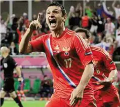  ?? AP ?? Celebratio­n time Russia’s Alan Dzagoev (left) celebrates after scoring against Czech Republic in a Group A clash on Friday.