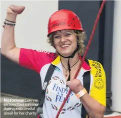  ??  ?? Victorious Corinne pictured last summer during a successful abseil for her charity