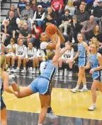  ?? STAFF PHOTO BY PATRICK MACCOON ?? Bradley Central's TaTianna Stovall makes a bucket under the hoop during Monday's home win over McMinn Central.