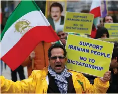  ??  ?? A PROTESTER chants slogans against the Iranian regime outside the European Union Council in Brussels on Tuesday.