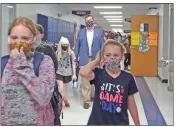  ?? KARIN HUFFMAN/CONTRIBUTI­NG PHOTOGRAPH­ER ?? Dion Stevens, superinten­dent of the Southside School District near Batesville, walks the hallways with students at Southside Middle School.