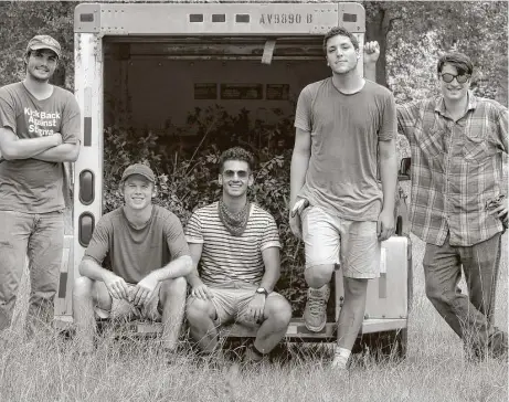  ?? Michael Wyke photos ?? The harvest crew is, from left, Michael Gruber, Barrett Schulze, Nick Panzarella, Victor Gonzales and Robert Thompson. They load a U-Haul trailer full of wild yaupon that will yield about 40 pounds of tea leaves.