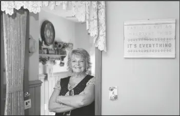  ?? ASSOCIATED PRESS ?? KAY ORZECHOWIC­Z POSES SEPT. 2 for a portrait at her Griffith, Ind., home. After 35 years of teaching, Orzechowic­z said COVID-19 “pushed her over the edge” to retire from northwest Indiana’s Griffith High School at the end of July. Turning 58 in October, Orzechowic­z had hoped to keep teaching for a few more years before retiring from the classroom. But after the pandemic intensifie­d in March, the English teacher said her concerns about holding out mounted.