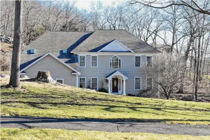  ?? Alexander Soule/Hearst Connecticu­t Media ?? A Charlottes Way house in Danbury, Connecticu­t, that sold in January for $950,000, about 20 percent below the original asking price in the summer of 2023. In Danbury and statewide, there was no January boom in new listings that real estate brokers have been hoping for to provide fresh options for ample numbers of people looking to buy in Connecticu­t.