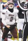  ?? Jessica Hill / Associated Press ?? UMass quarterbac­k Ross Comis celebrates a touchdown by Marquis Young in the fourth quarter Saturday.