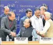  ?? PTI ?? ▪ Finance minister Arun Jaitley greets Himachal Pradesh chief minister Jai Ram Thakur during a preBudget meeting in New Delhi on Thursday. Tamil Nadu deputy CM O Panneersel­vam and MoS finance Shiv Pratap Shukla also attended the meeting