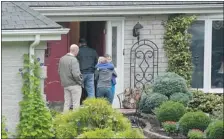  ?? The Associated Press ?? Visitors arrive at the home of Jeffrey Giuliano in New Fairfield, Conn.,
after he mistakenly shot and killed his own 15-year-old son, Tyler.