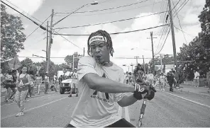  ?? ANA RAMIREZ/ USA TODAY NETWORK ?? People line the streets to watch a Juneteenth parade last year in Austin, Texas.