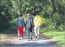  ??  ?? Three people walk along the Schuylkill River Trail at Pottstown Riverfront Park. Pottstown Hospital is launching a new Medicine on the Move program which invites community members to walk with physicians at a local park.