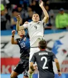  ??  ?? Chris Wood flies high to gain possession for New Zealand.