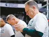  ?? AL GOLDIS/AP ?? Tom Izzo observes a moment of silence Tuesday before Michigan State’s first home game since a campus shooting killed three students and injured five others.