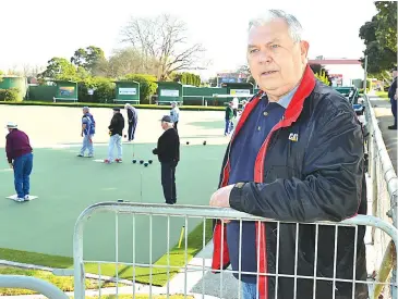  ??  ?? Drouin Bowls Club vice chairman Russell Dawson oversees the pairs action on the new synthetic green on Wednesday.