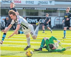  ??  ?? Scott Banks being felled by keeper Aidan McAdams.