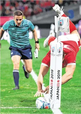  ??  ?? Wales’ wing Hallam Amos knocks on as he attempts to ground the ball during his team’s victory over Uruguay