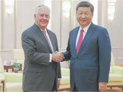  ?? | LINTAO ZHANG/ POOL PHOTO VIA AP ?? U. S. Secretary of State Rex Tillerson shakes hands with China’s President Xi Jinping before their meeting at the Great Hall of the People Saturday in Beijing, China.