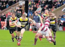  ??  ?? Forwardc charge Craig Pringle heads for the try-line in the match earlier in the season against Watsonians