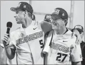  ?? ASSOCIATED PRESS ?? IN THIS JUNE 28, 2018, photo, former Oregon State coach Pat Casey (left) celebrates with his associate head coach Pat Bailey, after beating Arkansas for the NCAA College World Series baseball championsh­ip, in Omaha, Neb.