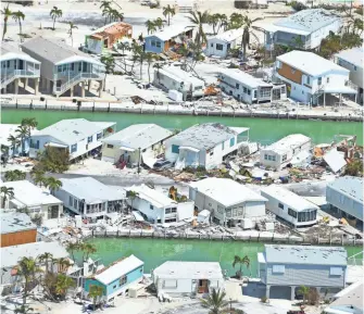  ?? PHOTOS BY JACK GRUBER, USA TODAY ?? Cudjoe Key in the lower Florida Keys took the full strength of Irma as it made landfall as a Category 4 storm early Sunday. Residents began returning to the upper islands Tuesday.