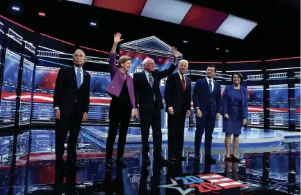  ?? ETHAN MILLER/GETTY IMAGES ?? Democratic presidenti­al candidates, from left, former New York City Mayor Mike Bloomberg; Sen. Elizabeth Warren, D-mass.; Sen. Bernie Sanders, I-VT.; former Vice President Joe Biden; former South Bend, Ind., Mayor Pete Buttigieg; and Sen. Amy Klobuchar, D-minn., arrive on stage for the Democratic presidenti­al primary debat Feb. 1 in Las Vegas.