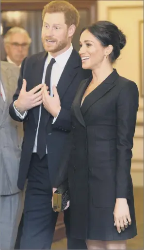  ??  ?? The Duke and Duchess of Sussex at the Victoria Palace Theatre before attending a gala performanc­e of the musical Hamilton, in support of Sentebale.