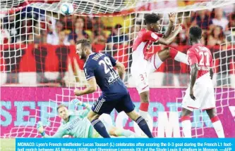  ??  ?? MONACO: Lyon’s French midfielder Lucas Tousart (L) celebrates after scoring the 0-3 goal during the French L1 football match between AS Monaco (ASM) and Olympique Lyonnais (OL) at the Stade Louis II stadium in Monaco. —AFP