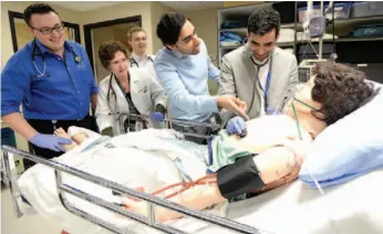  ?? CITIZEN PHOTO BY BRENT BRAATEN ?? Med students and residents work on a simulated patient at UHNBC. Pictured here, left to right: Ryan LeBlanc, Dr. Stacy Cabage, Jayden McIntyre, Dr. Al Jama, and Dr. Karim Saleh.