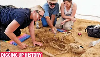  ?? ?? DIGGING UP HISTORY
Diligent: Anthropolo­gist Gaille MacKinnon, left, works on the human remains