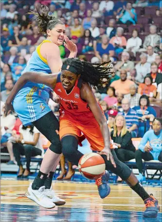  ?? SARAH GORDON/THE DAY ?? Connecticu­t’s Jonquel Jones (35) pushes past Chicago’s Stefanie Dolson during Friday night’s WNBA game at Mohegan Sun Arena. The Sky beat the Sun 96-83 to spoil their regular-season home finale.