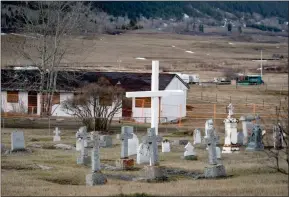  ?? The Canadian Press ?? A cemetery and a boarded-up abandoned building are seen on the former grounds of St. Joseph’s Mission residentia­l School in Williams Lake, on March 30, 2022.