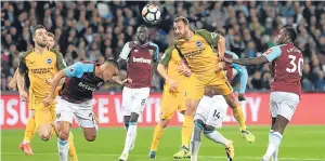  ??  ?? Brighton’s Glenn Murray heads home the opening goal of the game last night as The Seagulls defeated West Ham 3-0 at the London Stadium to climb to 10th in the English Premiershi­p. Izquierdo Mena added a second before Murray struck again from the...