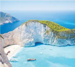  ?? — GETTY IMAGES FILES ?? Zakynthos is a little-explored paradise in the Ionian Sea where secret, pearlescen­t coves are hidden from plain sight by towering limestone bluffs.