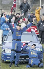  ??  ?? Mills and Solberg celebrate WRC title