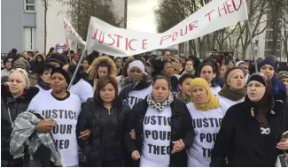  ?? ?? People march in the streets of Aulnay-sous-Bois, north of Paris, France, holding a sign reading "Justice for Theo" during a protest after an officer was charged with violence