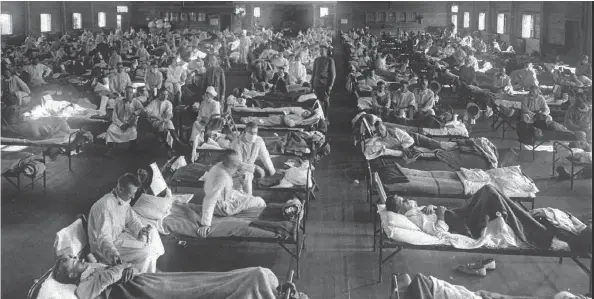  ?? NATIONAL MUSEUM OF HEALTH AND MEDICINE, ARMED FORCES INSTITUTE OF PATHOLOGY / WASHINGTON, D.C. ?? Influenza victims crowd into an emergency hospital near Fort Riley, Kan., in this 1918 photo. The 1918 Spanish flu pandemic killed at least 20 million people worldwide, and Canada was not spared. In the space of a few months, 50,000 Canadians were struck down.