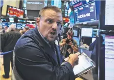  ??  ?? WORRY: Trader Michael Milano at the New York Stock Exchange,