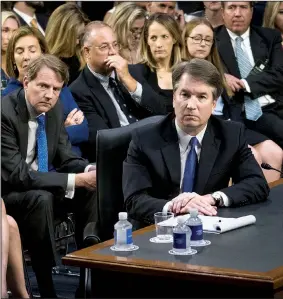  ?? The New York Times/DOUG MILLS ?? Supreme Court nominee Brett Kavanaugh listens to senators’ statements Tuesday during the contentiou­s start of his confirmati­on hearing in the Senate Judiciary Committee. Seated behind him at left is White House counsel Don McGahn.