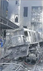  ?? AFP ?? The scene of a fiery train crash at Cairo's main railway station on ▪Wednesday.