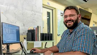  ??  ?? Southland District Council building solutions officer Carl Trollip tests new GoGet software for full electronic submission and processing of building consent applicatio­ns.