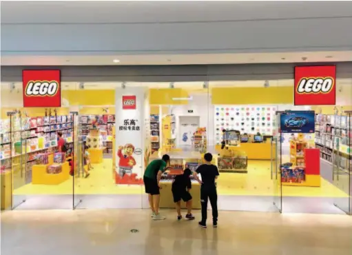  ??  ?? A certified Lego store in Beijing. Lego Group is gradually expanding to more second- and thirdtier cities in China. VCG