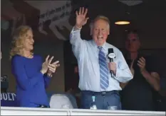  ??  ?? In this Oct. 20 file photo, Vin Scully acknowledg­es the crowd from a box before Game 5 of the National League baseball championsh­ip series between the Chicago Cubs and the Los Angeles Dodgers in Los Angeles. AP PHOTO