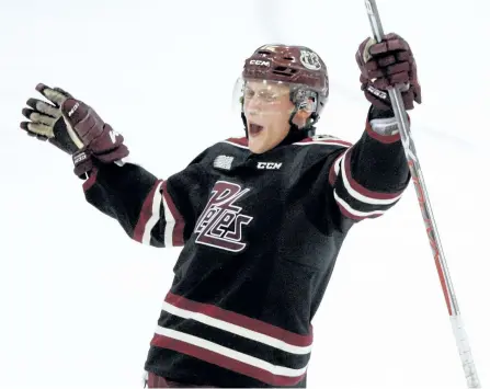  ?? CLIFFORD SKARSTEDT/EXAMINER ?? Peterborou­gh Petes forward Steve Lorentz celebrates his winning goal scored against the Kingston Frontenacs during the third period of OHL action on Thursday night at the Memorial Centre. The Petes won 3-1. See more photograph­s from the game in the...