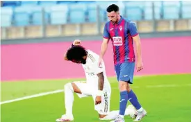  ?? AP ?? Real Madrid’s Marcelo takes a knee as he celebrates his goal during the Spanish La Liga match between Real Madrid and Eibar at Alfredo di Stefano stadium in Madrid, Spain, Sunday, June 14, 2020.