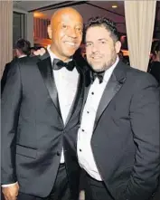  ?? Kevin Mazur VF13 WireImage ?? FILMMAKER Brett Ratner, right, with Russell Simmons in 2013. The pair met in 1987, and Ratner became the Def Jam Recording mogul’s protege.