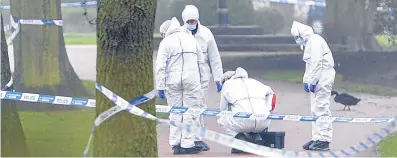  ??  ?? Police conduct a forensic search of the public park where the body of Vicktorija was found