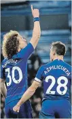  ?? TIM IRELAND THE ASSOCIATED PRESS ?? Chelsea’s David Luiz celebrates, with teammate Cesar Azpilicuet­a, after scoring City’s second goal.