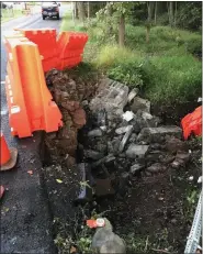  ?? SUBMITTED PHOTO - COURTESY OF TOWAMENCIN TOWNSHIP ?? Newly damaged stone is seen running along a culvert on Rittenhous­e Road in Towamencin after being hit for the second time in two months.