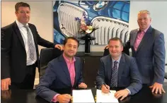  ??  ?? Paul Ahern Managing director Aherns Castleisla­nd signing a new contract with Paulo Alves BMW Ireland , John Lawlor BMW and Pat Ahern Director Aherns Castleisla­nd.