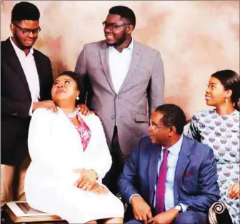  ??  ?? The Family Man’, Chinwe Aguma, SAN, with his wife, Mrs Inime Aguma, and children (standing from the left) Eze, Chima and seated, Onyinye