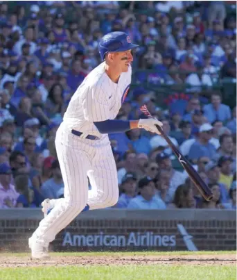  ?? NUCCIO DINUZZO/GETTY IMAGES ?? Cubs first baseman Frank Schwindel comes through with a single in the eighth inning off Reds reliever Michael Lorenzen to break a 3-3 tie. The Cubs won their seventh consecutiv­e game.