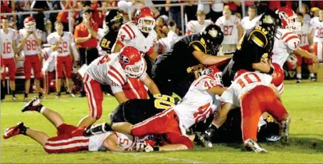  ?? PHOTOS BY MARK HUMPHREY ENTERPRISE-LEADER ?? Weston Barthomolo­mew of Prairie Grove shown carrying the football against U.S. 62 rival, Farmington, completed a stalwart career as a Tiger running back as a senior.